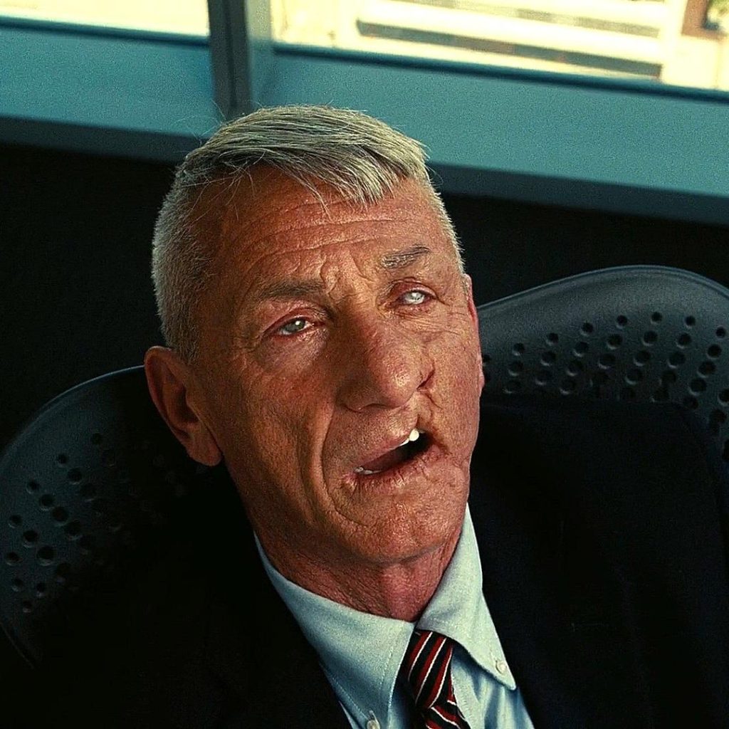 Sean Penn as Col. Lockjaw in his final scene. He has one milky eye and a prominent facial scar on the left side of his face.